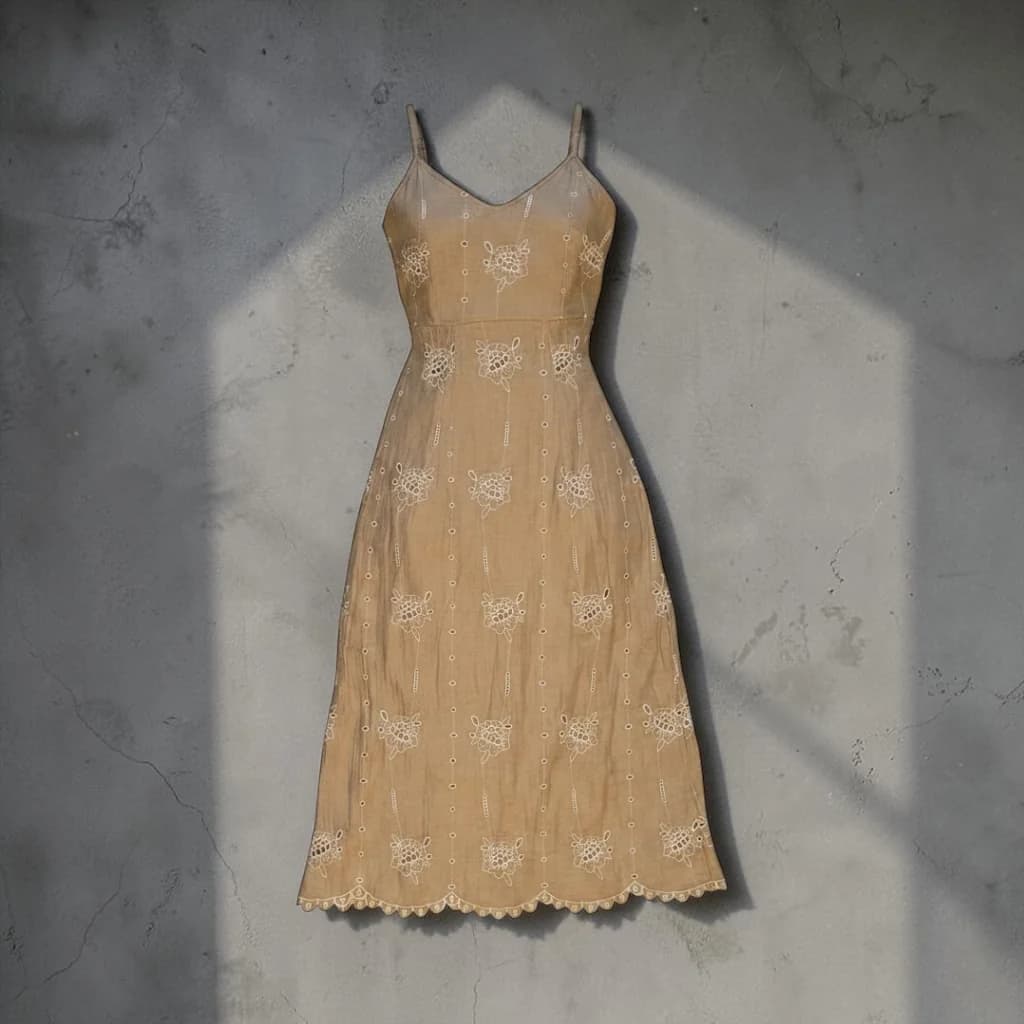 Brown eyelet midi sundress with thin straps, photographed flat